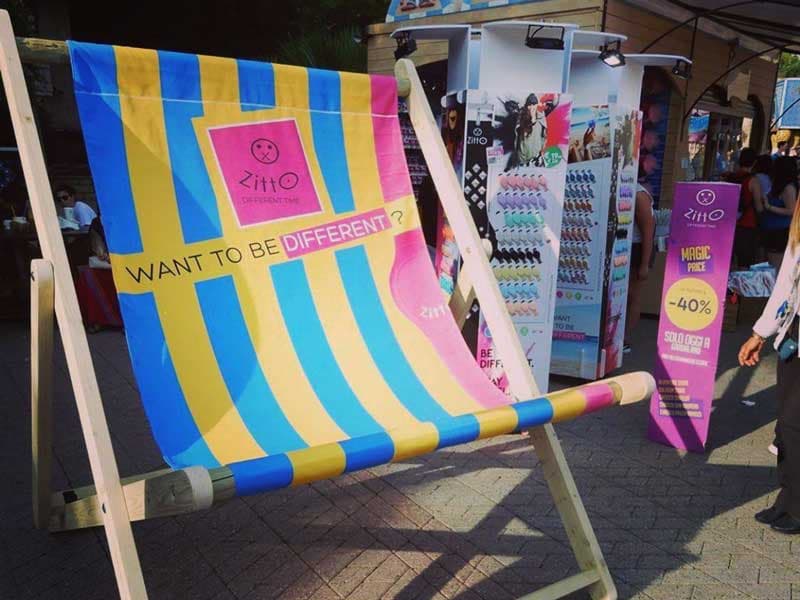Giant branded deckchair at a product launch pop-up shop