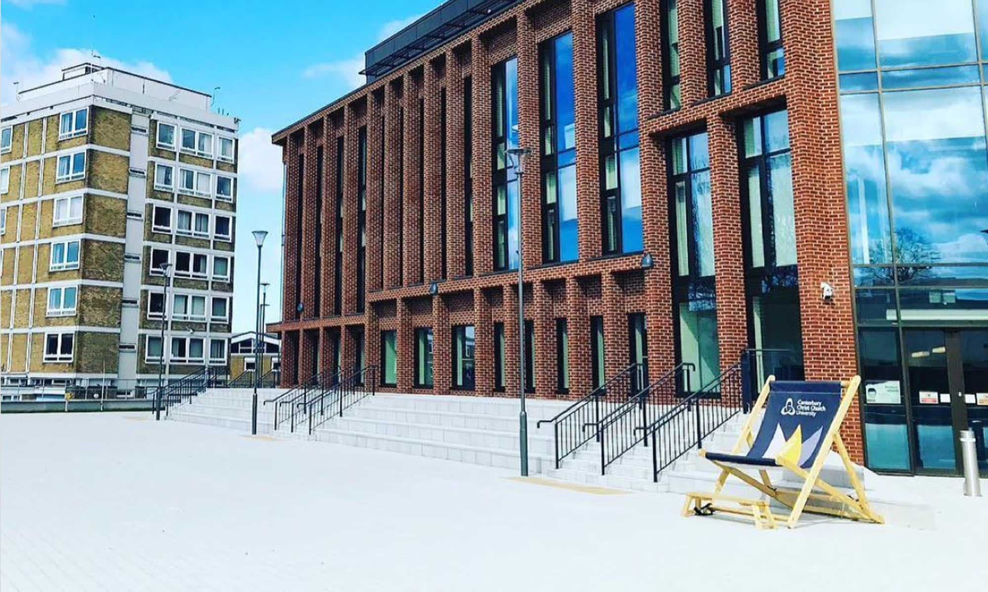 University-branded giant deckchair on a modern campus